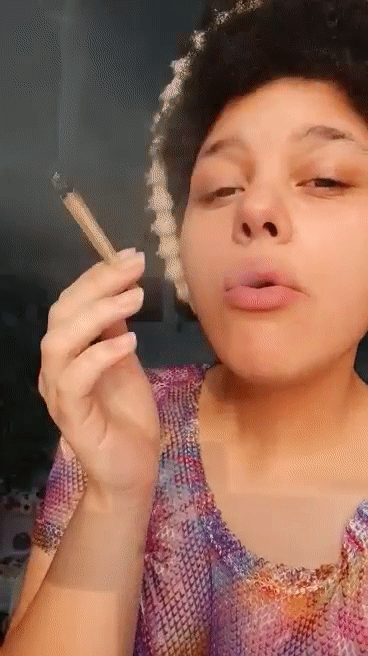 Nadia smokes while also smoking